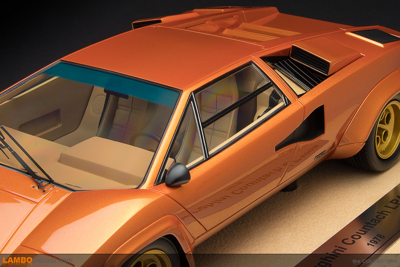 The tan interior inside this orange metallic Lamborghini Countach LP400S looks amazing